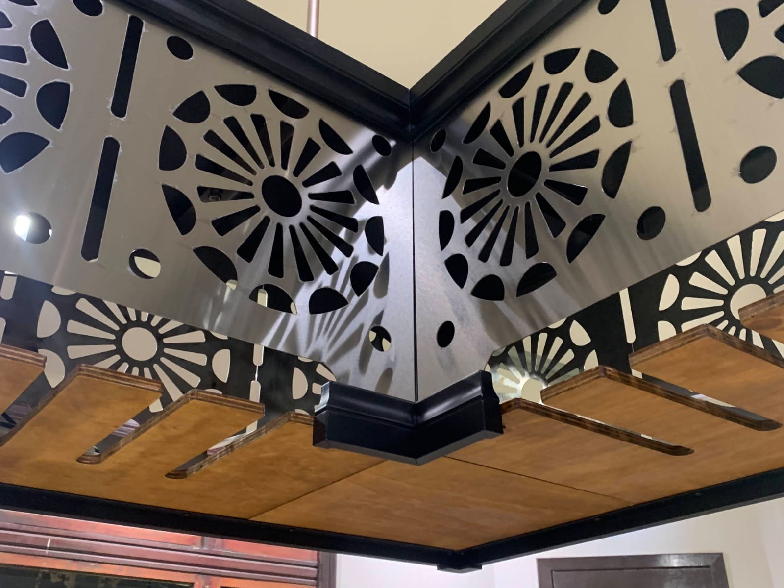 Corner detail showing patterned stainless steel panels