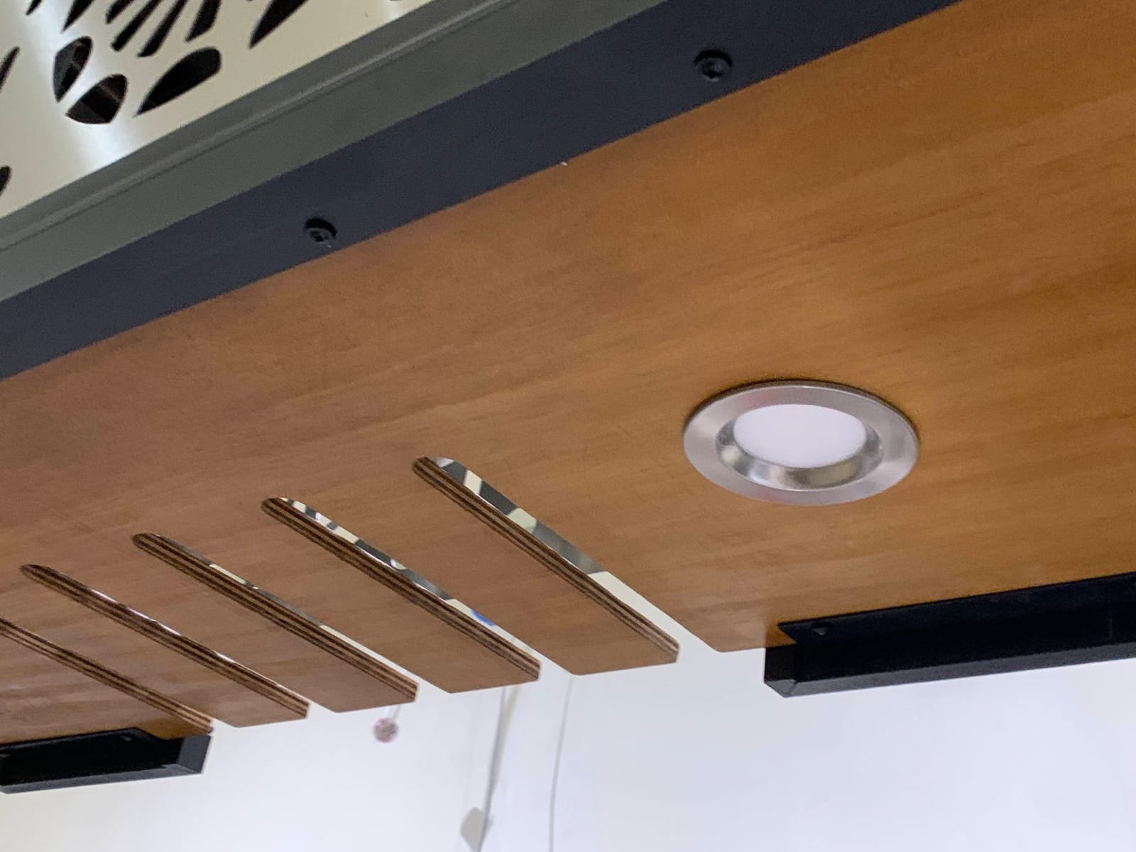 Slotted plywood glass holder underside detail